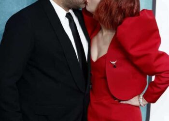 Lady Gaga Gives Nod To Harley Quinn, Romances Michael Polanksy On Red Carpet